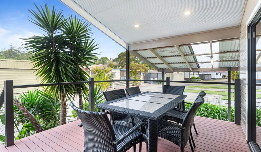 Large back deck of the Executive Unit with outdoor dining setting