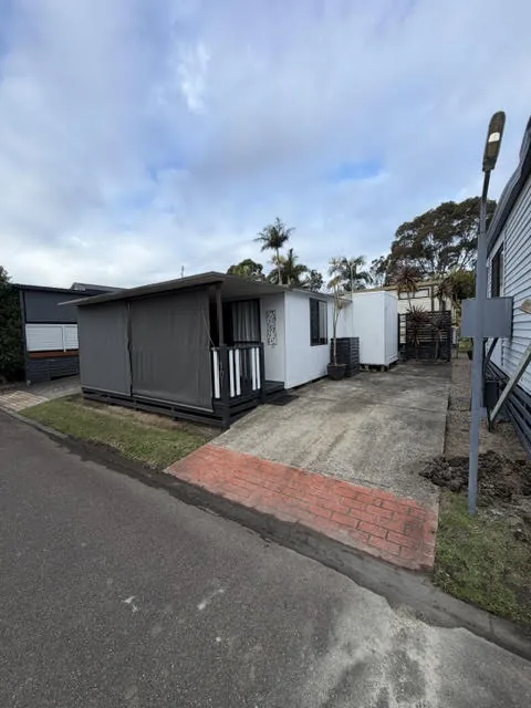 A 22 foot van with an aluminium annexe and a front veranda