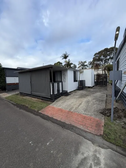 A 22 foot van with an aluminium annexe and a front veranda