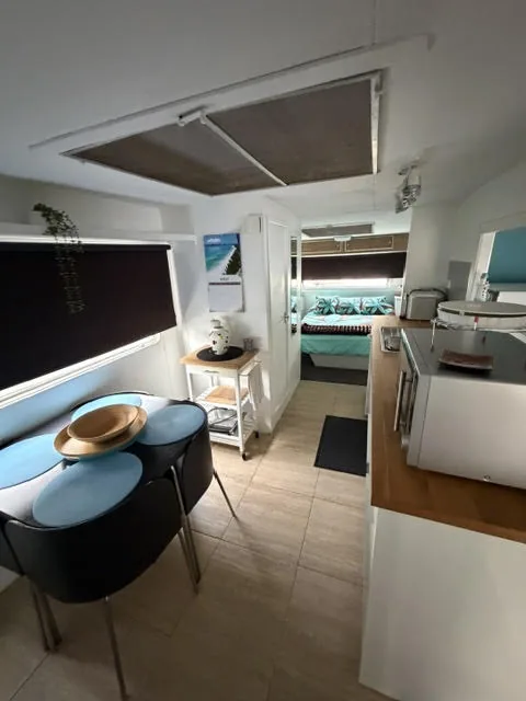 The annexe kitchen with cupboards and bench space