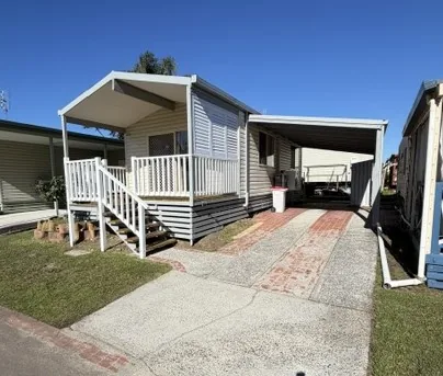A renovated two bedroom relocatable home with a carport